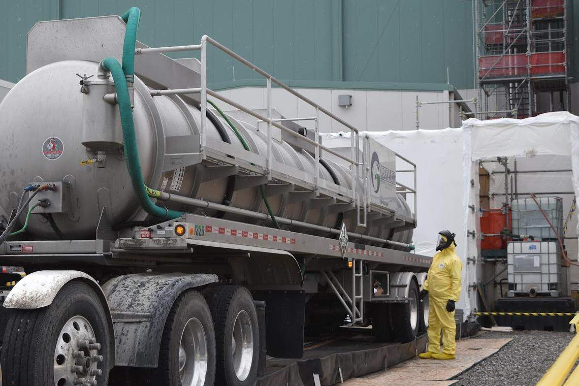 Workers offload a mix of nitrates and other materials into the Low Activity Waste Facility at the Hanford vitrification plant. The mixture will simulate Hanford tank waste in testing and practice runs in preparation for treating radioactive waste this summer.