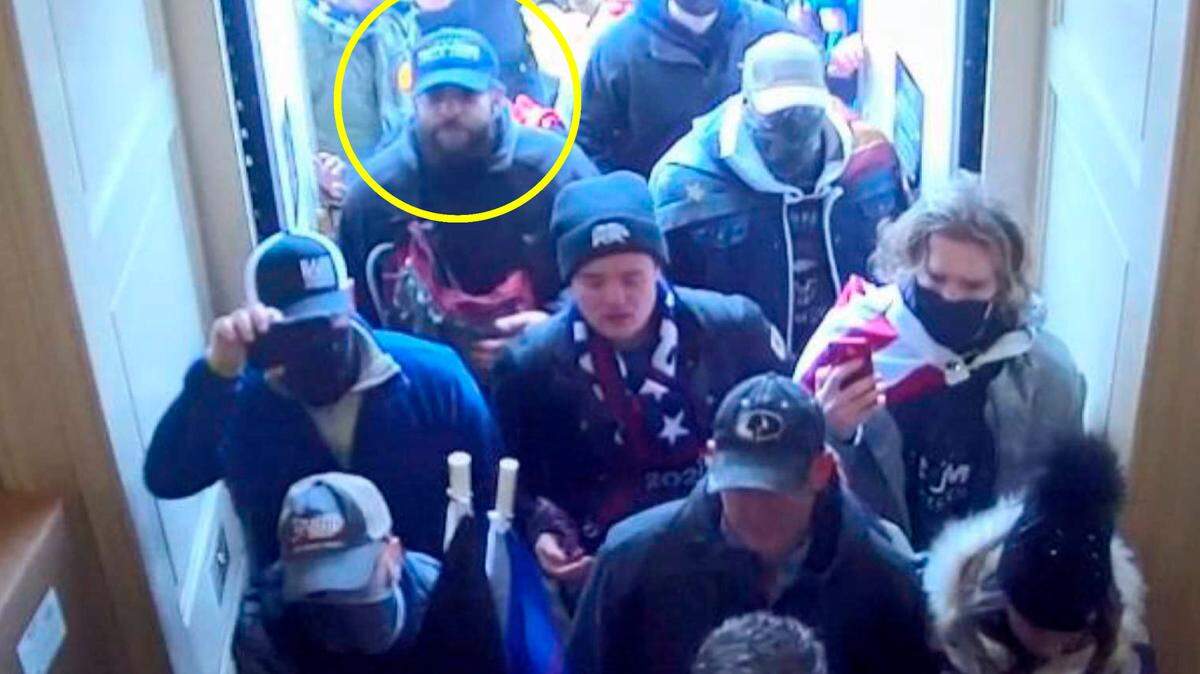 In this image from U.S. Capitol Police security video, released and annotated by the Justice Department in the Statement of Facts supporting an arrest warrant, Taylor Taranto, circled in yellow, enters the U.S. Capitol on Jan. 6, 2021.