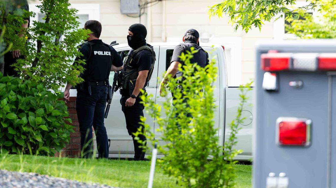 Police and federal drug agents force open door of a home near Richland school