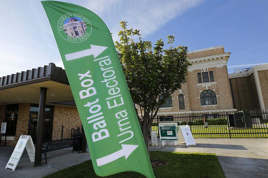 Signs point to the ballot drop box located just outside the security building at the Franklin County Courthouse in Pasco. 