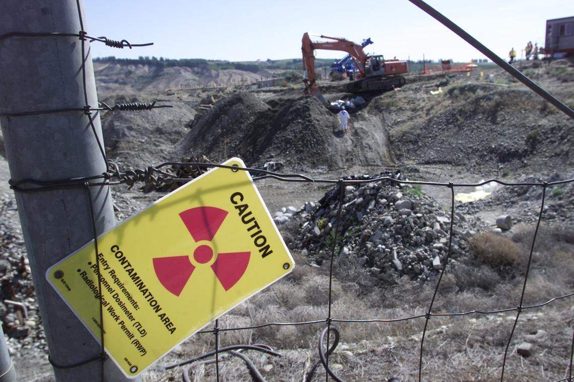 Drums containing shavings of depleted uranium discovered in a waste burial area at the Hanford nuclear site are dug up.