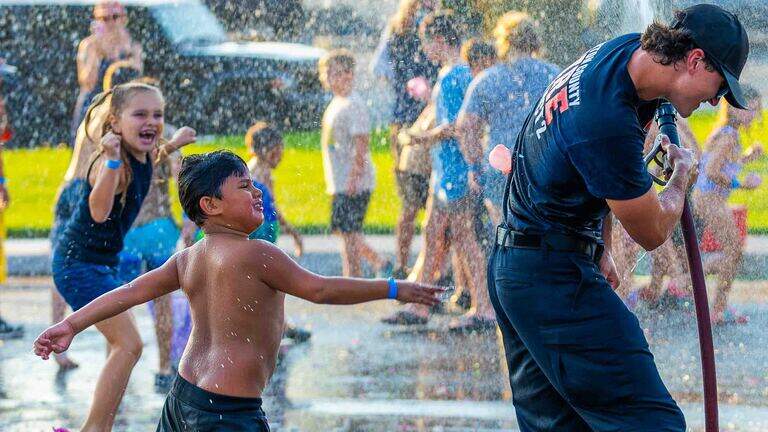 Water balloons, hot dogs and community: Benton City celebrates National Night Out