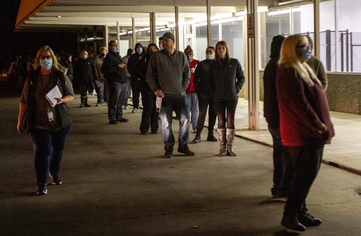 The line of people waiting at the Benton County Voting Center on North Columbia Center Boulevard in Richland late Tuesday stretched around the building.