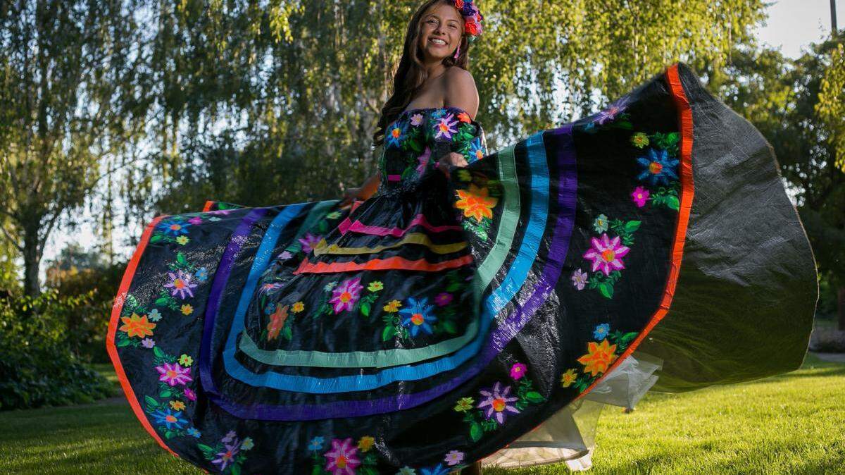 Larissa Leon, 17, poses for a portrait in her ranchero dress, a traditional Mexican dress designed for Folklorico dancers, that is entirely made out of duct tape at her home in Sunnyside, Wash.