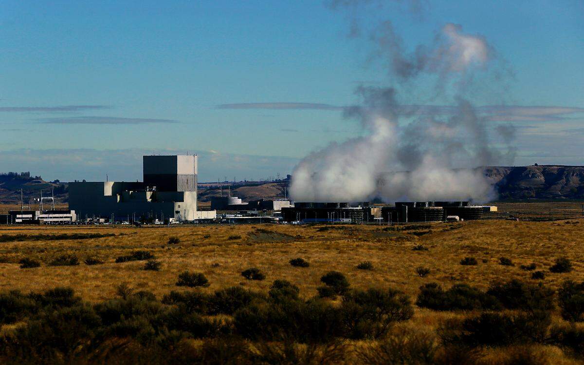 Steam rises from the cooling towers at the Columbia Generating Station operated by Energy Northwest near Richland, WA.