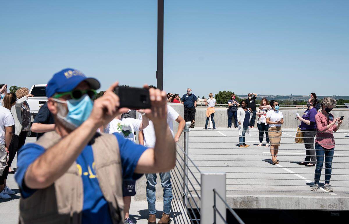 Crowds gathered Friday on the top floor of the Kadlec Regional Medical Center parking garage to watch a flyover of two KC-135 Stratotankers honoring frontline workers in the coronavirus pandemic.