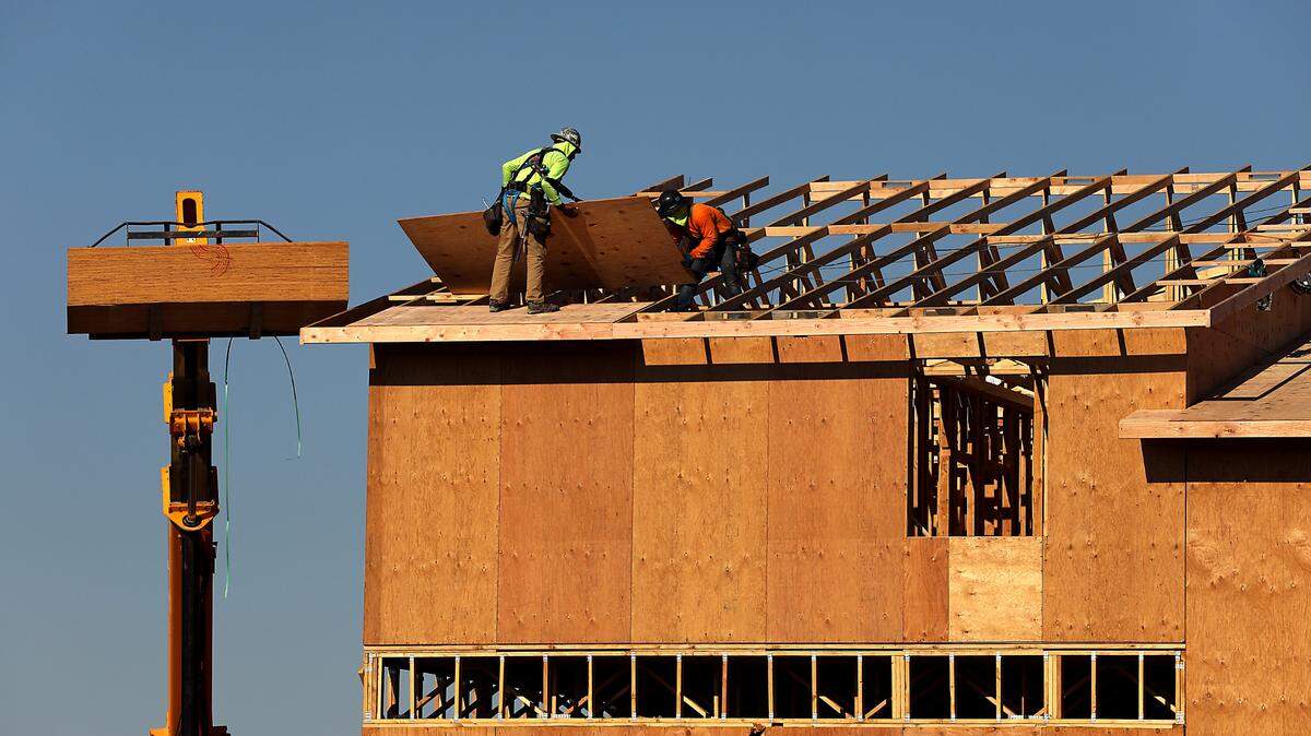Washington law requires employers to protect outdoor workers from excessive heat. In this 2023 photo, construction workers at The Resort at Hanson Park in Kennewick wear protective clothing while working in the August heat.