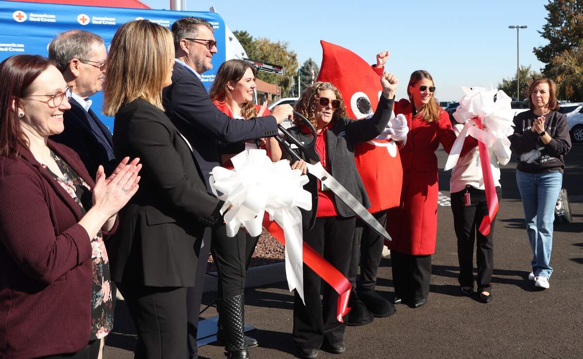 Red Cross staff, Kennewick Mayor Gretl Crawford, Mayor Pro Tem Chris Torelli and Executive Director Michele Roth celebrate the ribbon cutting for the newly remodeled west Kennewick Red Cross building.