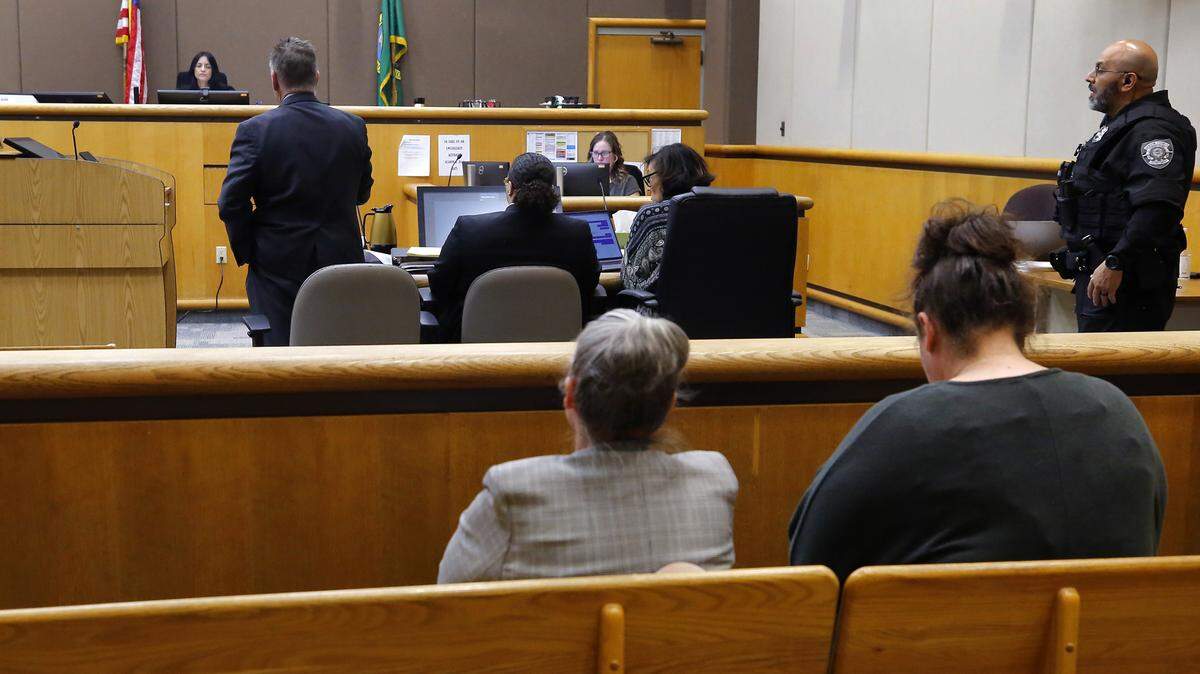 Defense Attorney Bob Thompson, standing at left, talks to Benton County Superior Court Judge Norma Rodriguez during the murder trial for Marcell Cola in Kennewick. He is the first of four accused shooters to go on trial for the October 2022 shooting death of Jatzivy Sarabia.