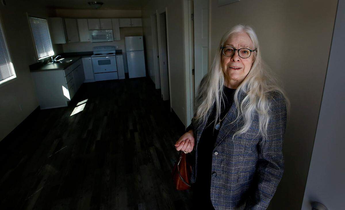 Lona Hammer, Kennewick Housing Authority executive director, stands inside a two-bedroom tiny house at the Lilac Homes development on East 13th Avenue.