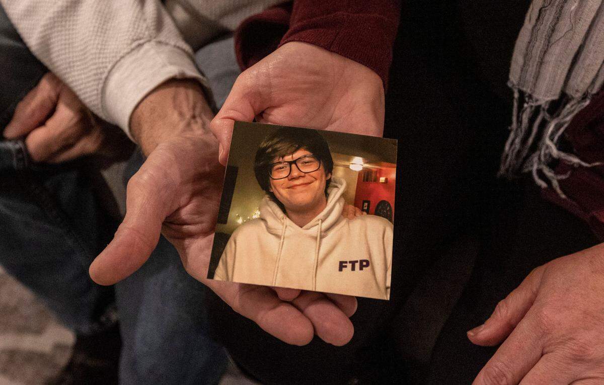 Curt and Shannon Cartier hold a picture of their late son, Cannon, who died in 2021 from a fentanyl overdose. Cannon was one of more than 100,000 drug overdose deaths in the United States last year alone.