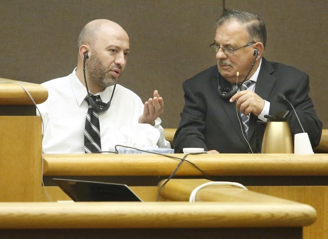 Abdul Rahman Sweidan, left, testifies Thursday through a court interpreter in Benton County Superior Court he was attacked by his wife with a knife and then she attempted suicide by stabbing herself in their Kennewick apartment. He is charged with attempted second-degree murder and first-degree assault for the Aug. 30 stabbing of his wife Dania Z. Alhafeth. Court interpreter Walid Farhoud sits next to him. Watch a video: tricityherald.com/video