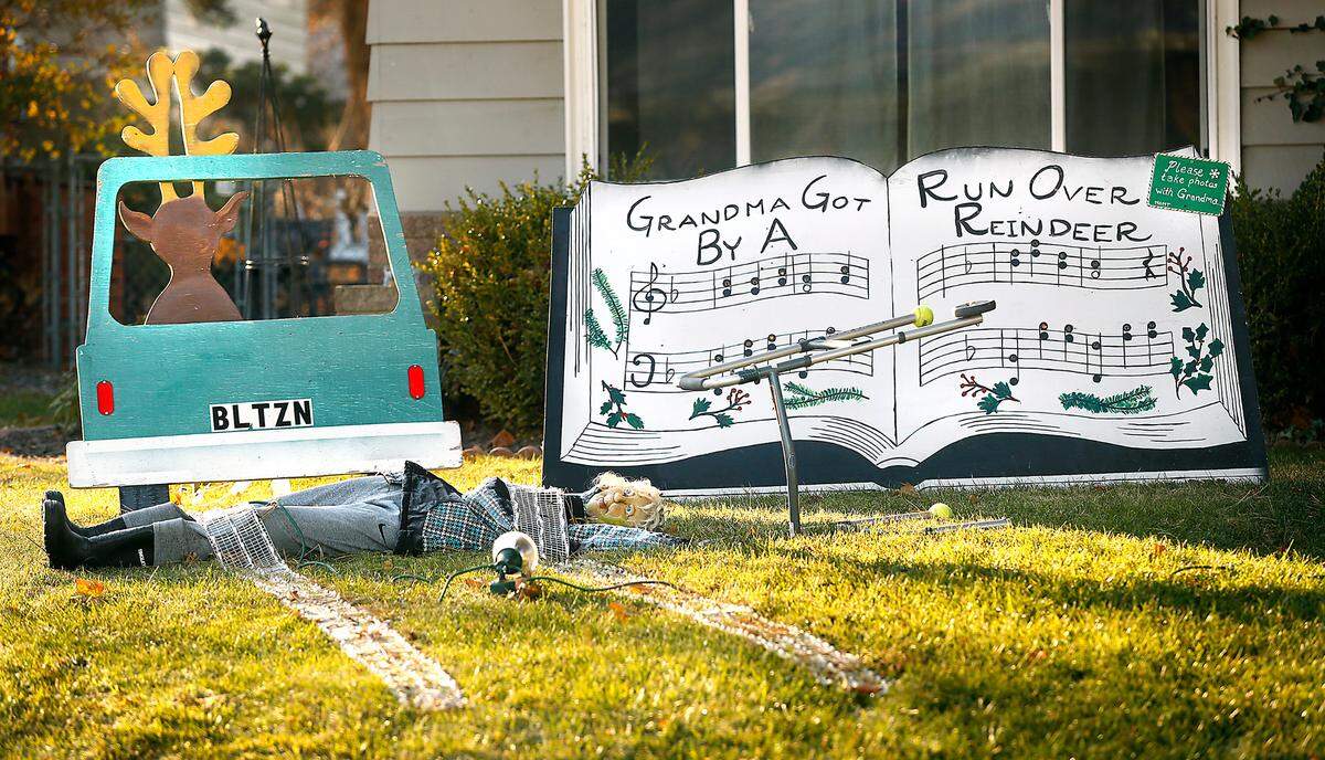A whimsical display for the Christmas song “Grandma Got Run Over By A Reindeer” is part of themed decorations at Christmas Carol Lane in Kennewick. 