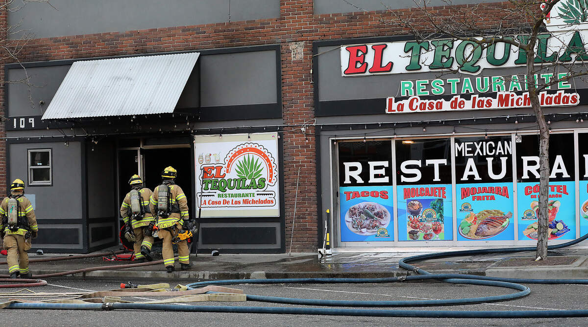 Firefighters from around the Tri-Cities work early Tuesday morning to extinguish a fire at the El Tequilas Restaurant in downtown Kennewick.