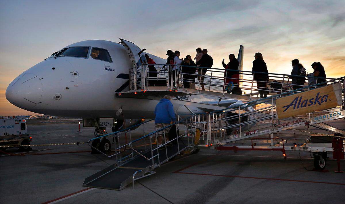 Passengers board Alaska Airlines’ new daily flight between the Tri-Cities Airport and LAX Tuesday morning in Pasco. The 76-seat Embraer carrying 48 travelers plus crew departed shortly after sunrise.