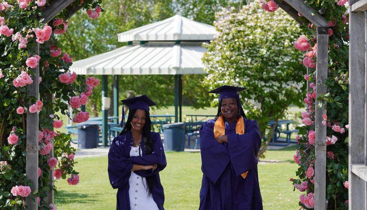 Kennewick mother and daughter Samira Hefa, 43, right, and Amina Mann, 18, pose for photos at the rose garden at Highlands Grange Park.
