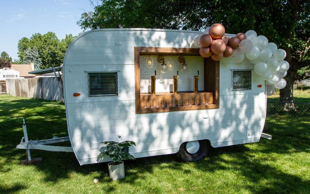 The white La Cantina Mobile Bar trailer is one of several mobile options owner Criselda Davila can offer clients.