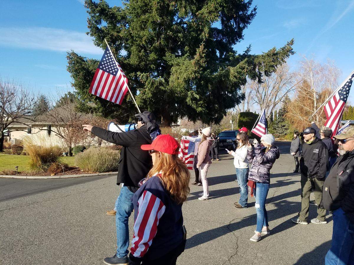 After a rally at the Franklin County Courthouse, many of the protesters headed over to protest outside the home of Commissioner Brad Peck, concerned that he is not doing enough to fight restrictions on businesses.