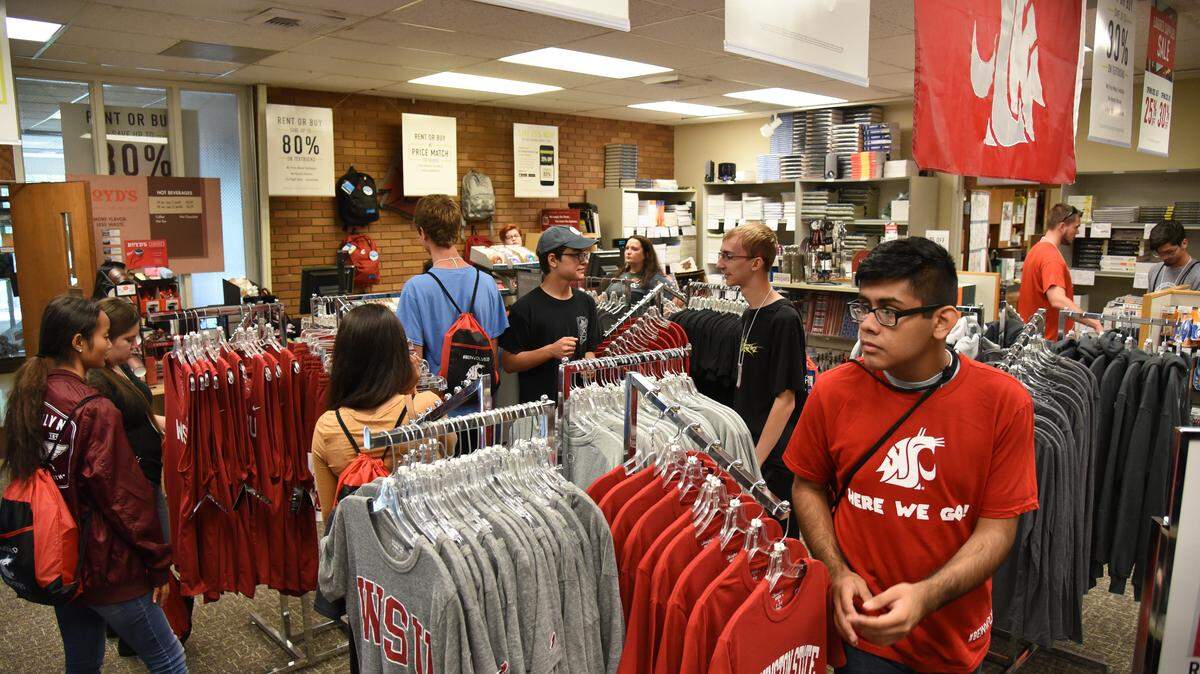 New students walk through WSU Tri-Cities’ student bookstore during the August orientation. The number of new students dropped this year.