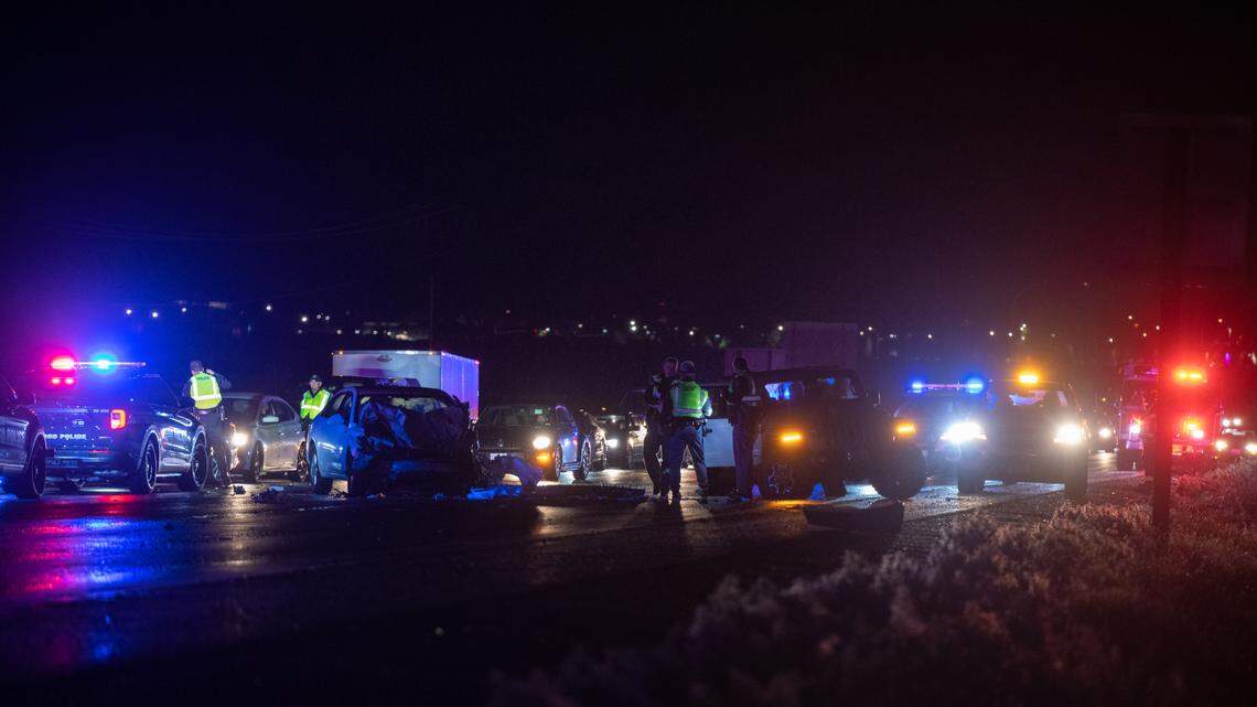 Washington State Patrol troopers investigate a three-car crash in the westbound lanes of Interstate 182 late Sunday. Two people were taken to the hospital.