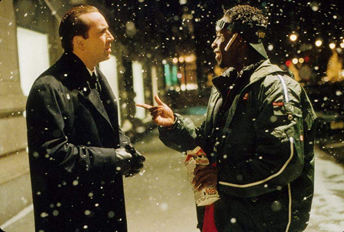 Nicolas Cage and Don Cheadle in “The Family Man.”