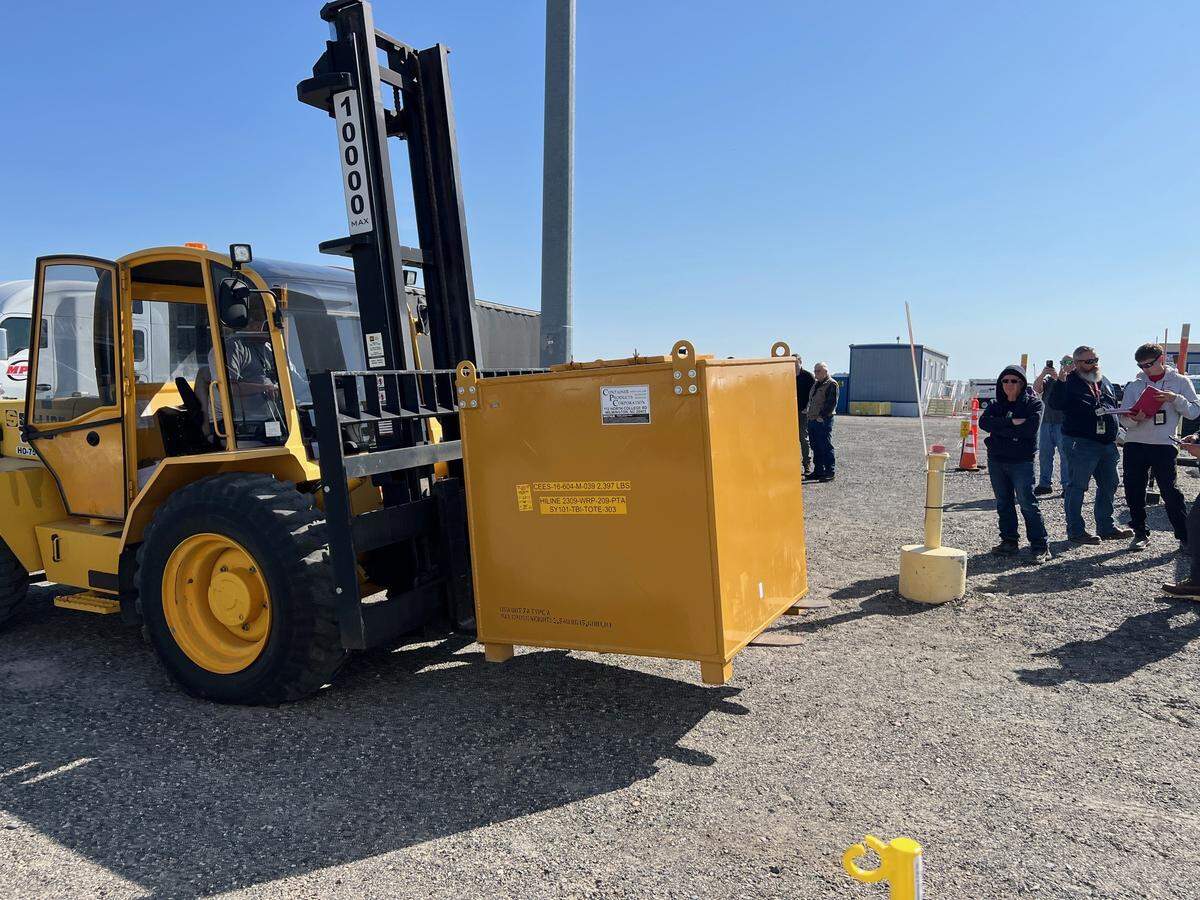 A shipping container, called a tote, that is filled with liquid, low activity radioactive waste from a Hanford site underground tank is about to be loaded onto a truck to be sent to a Utah facility for treatment and disposal.