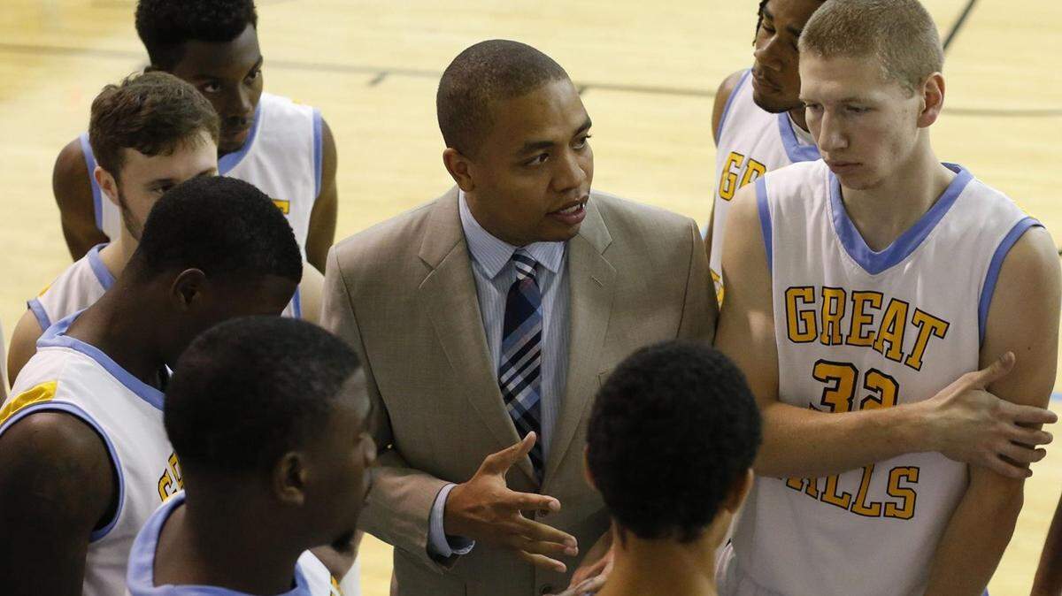 Anthony Owens, center, has been named as CBC’s men’s basketball head coach.