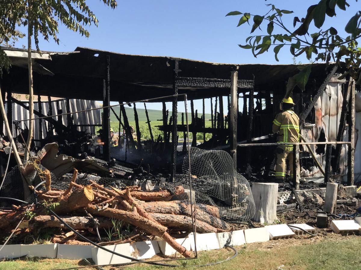The fire in this Benton City manufacture home claimed the life of two children who were inside. Now the parents are suing their former employer.