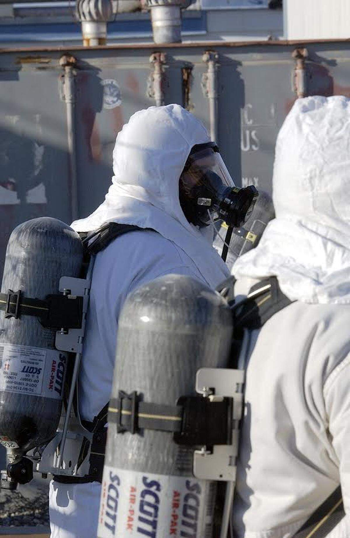 Workers use supplied air respirators and carry oxygen tanks to protect against breathing harmful chemical vapors at some of the Hanford tank farms.