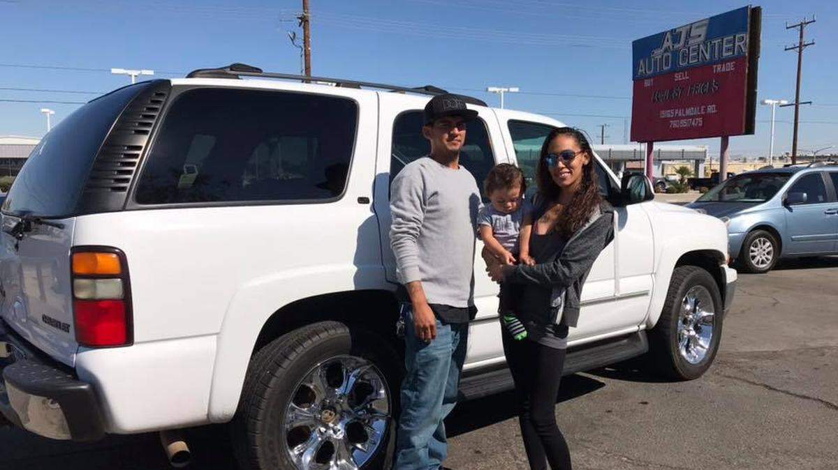 Miguel Salgado and his wife and daughter pose with the Chevy Tahoe soon after they bought it in California in October. The SUV was stolen from outside of their Kennewick apartment just before they were to head back to California for the holidays.