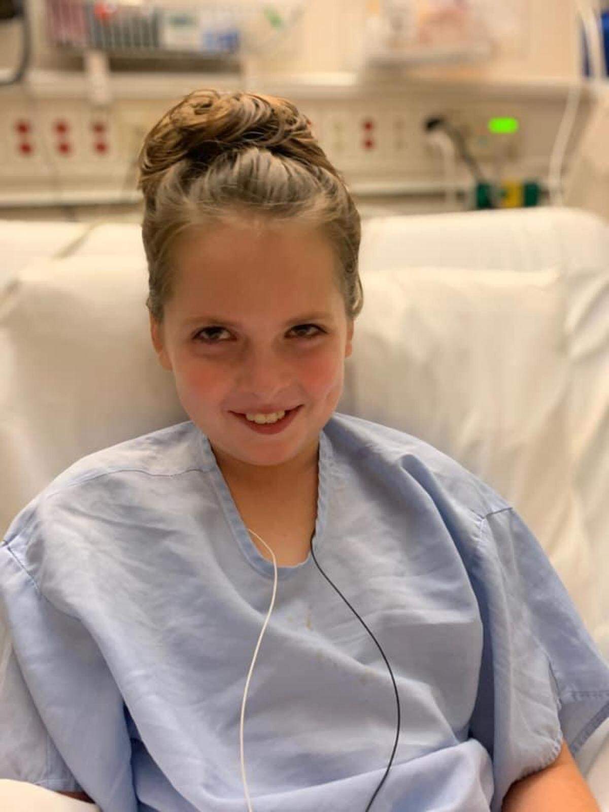 Lana McDowell is shown in 2021 before one of her surgeries at Seattle Children’s Hospital to remove a baseball-size tumor.