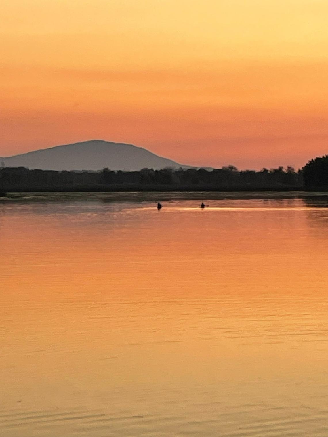 Rattlesnake Mountain can be seen from Bateman Island in Richland as the sun sets during the July 2024 heat wave.
