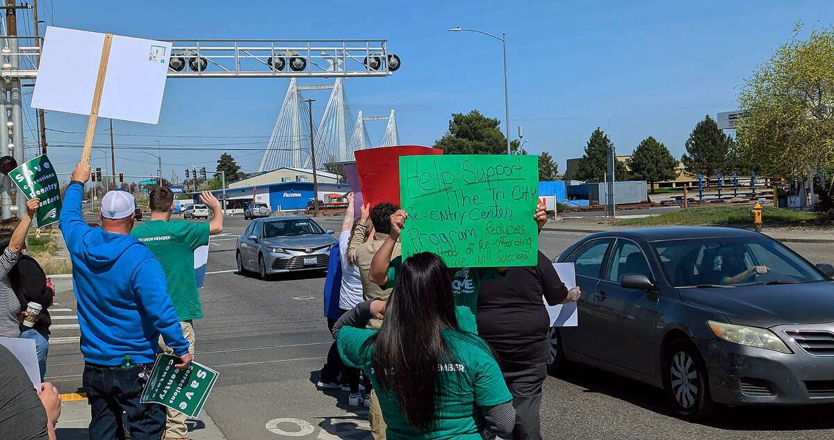 About 50 people rallied April 6 outside the Washington corrections department’s Tri-Cities Reentry Center for prison inmates in downtown Kennewick.