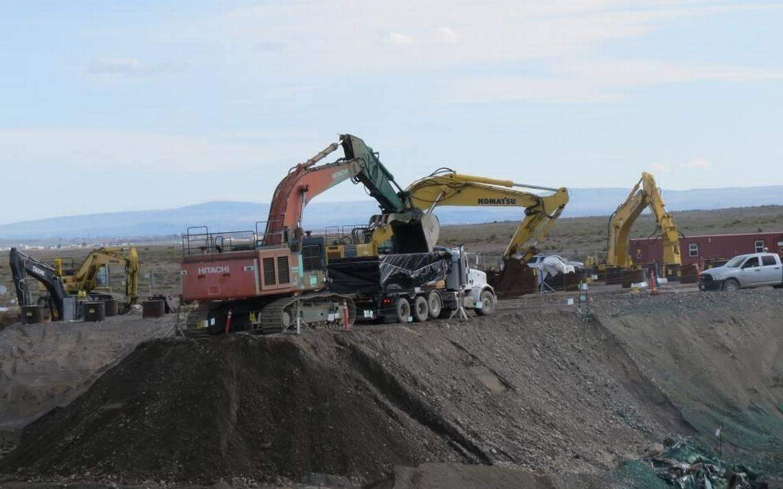 Contaminated soil at Hanford’s 618-10 Burial Ground is loaded into containers to be taken to a central Hanford landfill. The soil was near vertically buried pipes filled with waste that have been cleaned up.