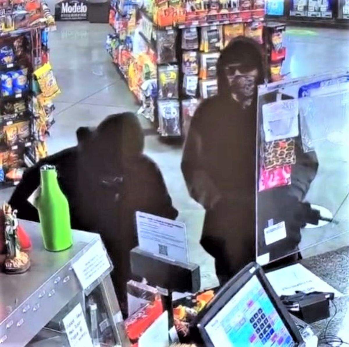 Pasco police are searching for two men who grabbed cash and cigarettes during a Monday night robbery.