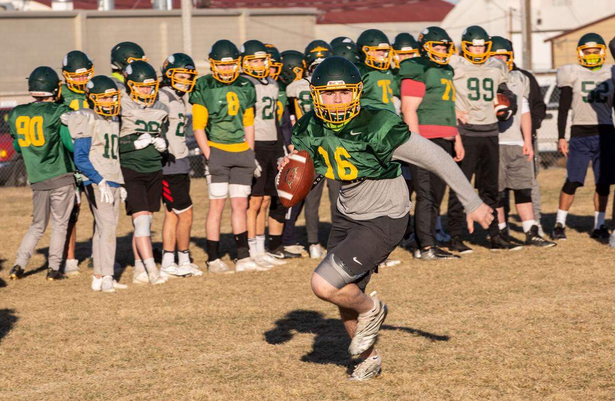 The Richland High School Bombers football team runs drills on their practice field off of Wellsian Way in Richland for the upcoming abbreviated spring 2021 football season that begins Feb. 26.