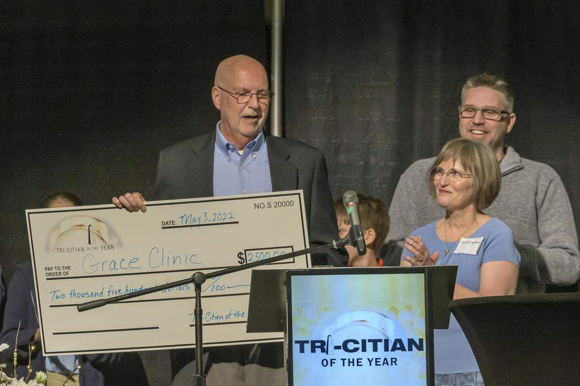 Mark Brault, the volunteer chief executive of Grace Clinic, was named Tri-Citian of the Year for 2022. His family, including wife, Kathy, were there when he was surprised with the award.