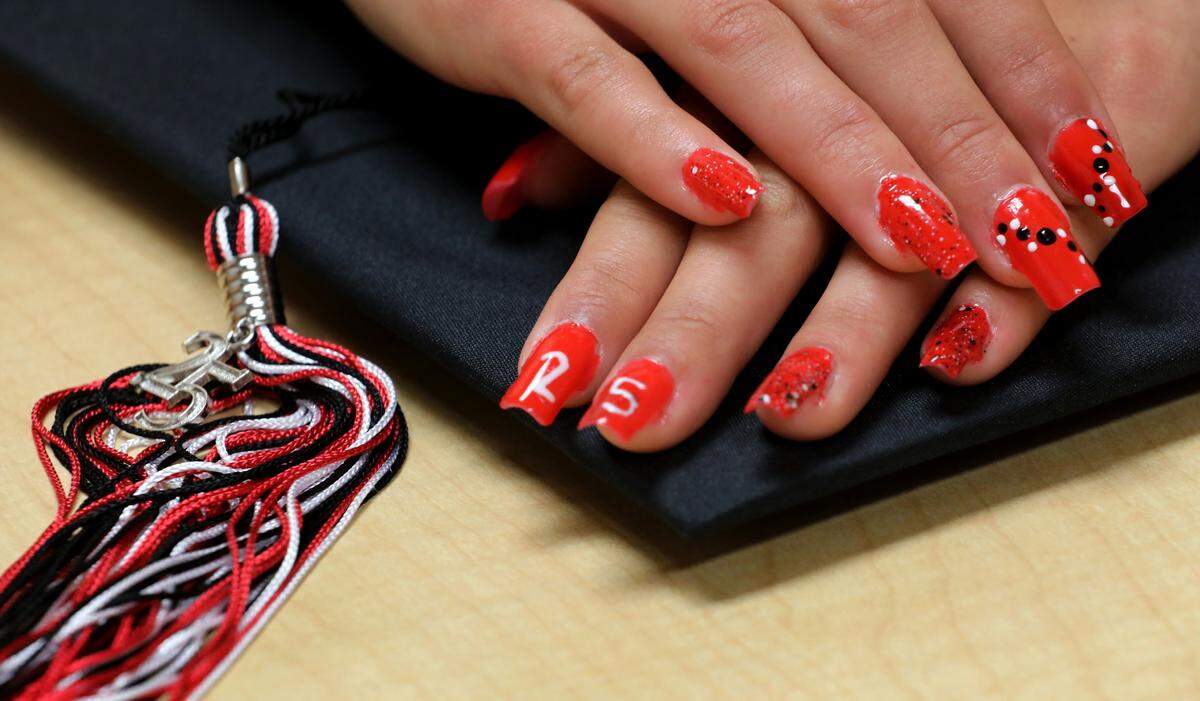 Aliyah Malone painted her fingernails with the school colors as she counts down to commencement.