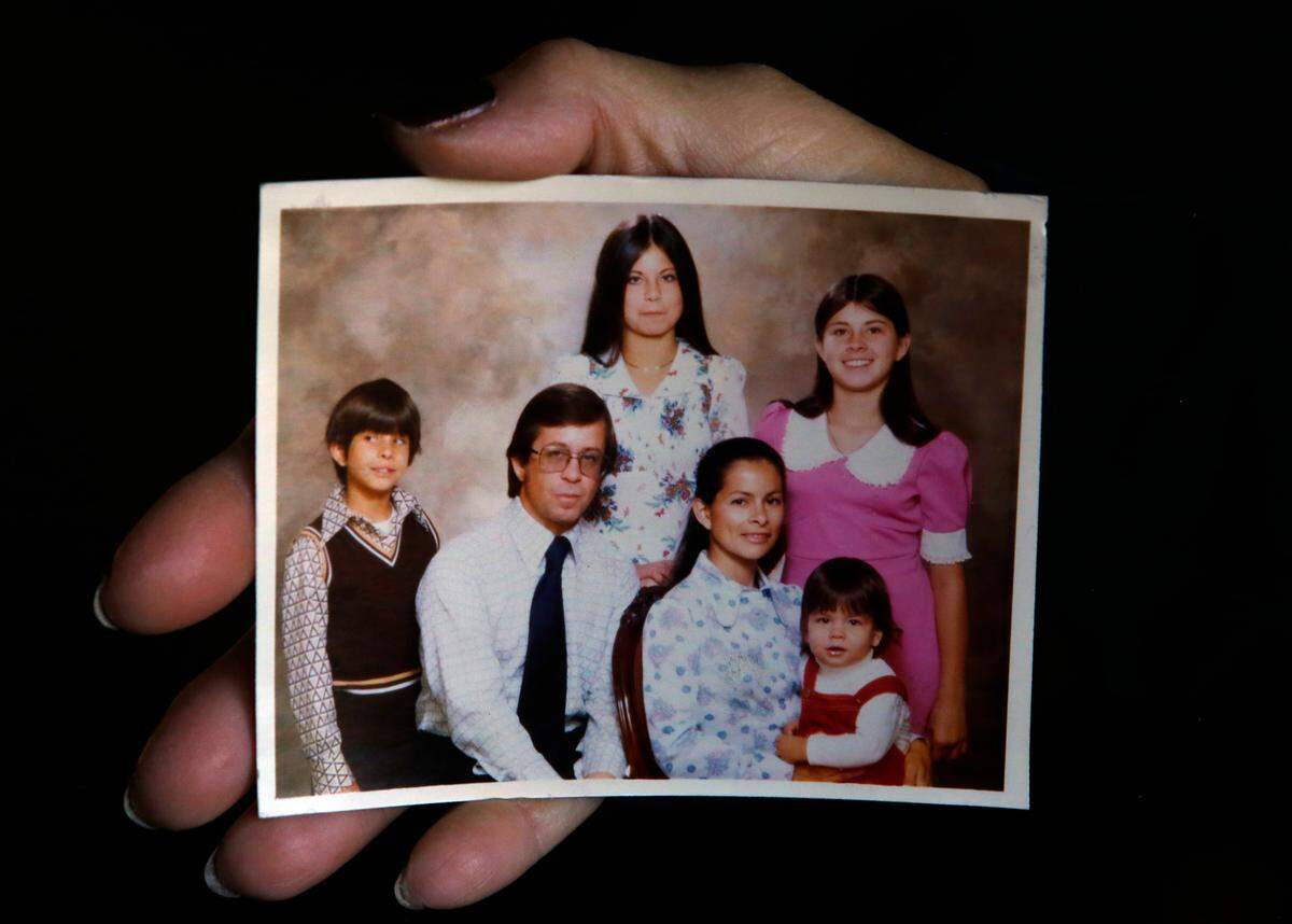 Kathy Shirey of Kennewick holds a family photo taken in 1975.