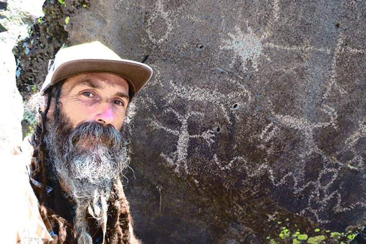 Ras Vaughn with Indian pictographs at Hart Lake, Oregon.