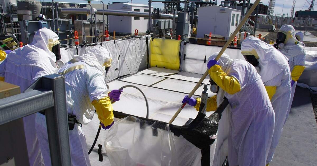 Hanford workers finish connecting underground tanks with the nearby vitrification plant, which as begun turning some radioactive waste from the tanks into a stable glass form for disposal.