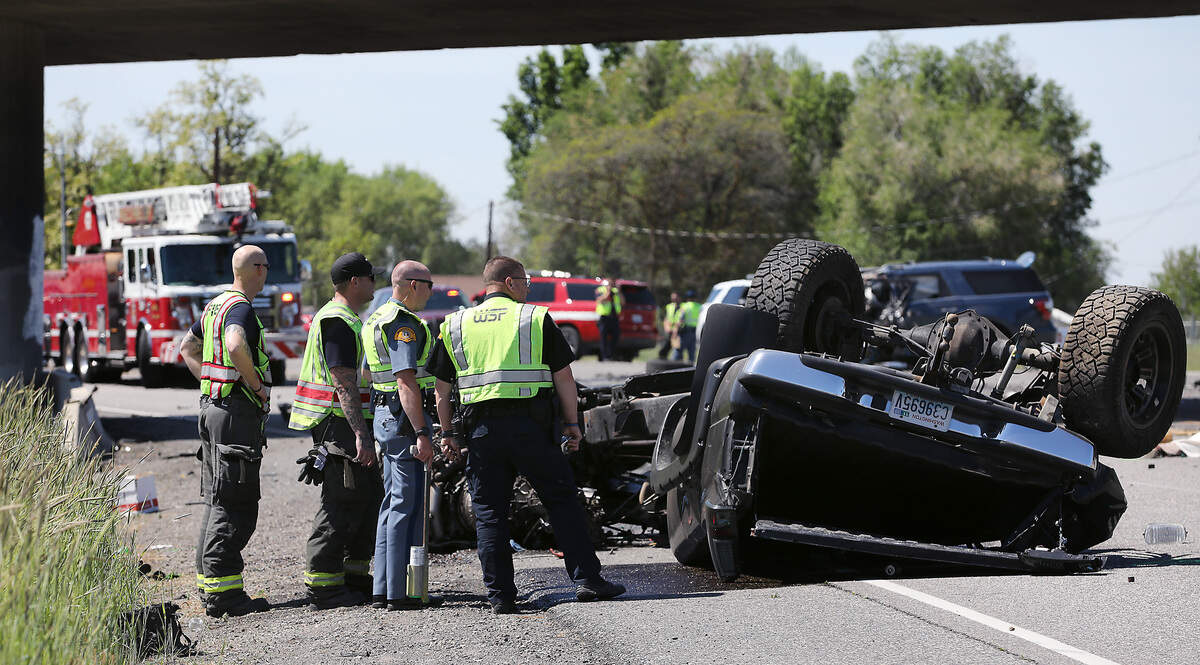 Washington State Patrol troopers and Pasco Fire department investigate the scene of Thursday's double fatal collision at the Lewis Street exit on Highway 395.