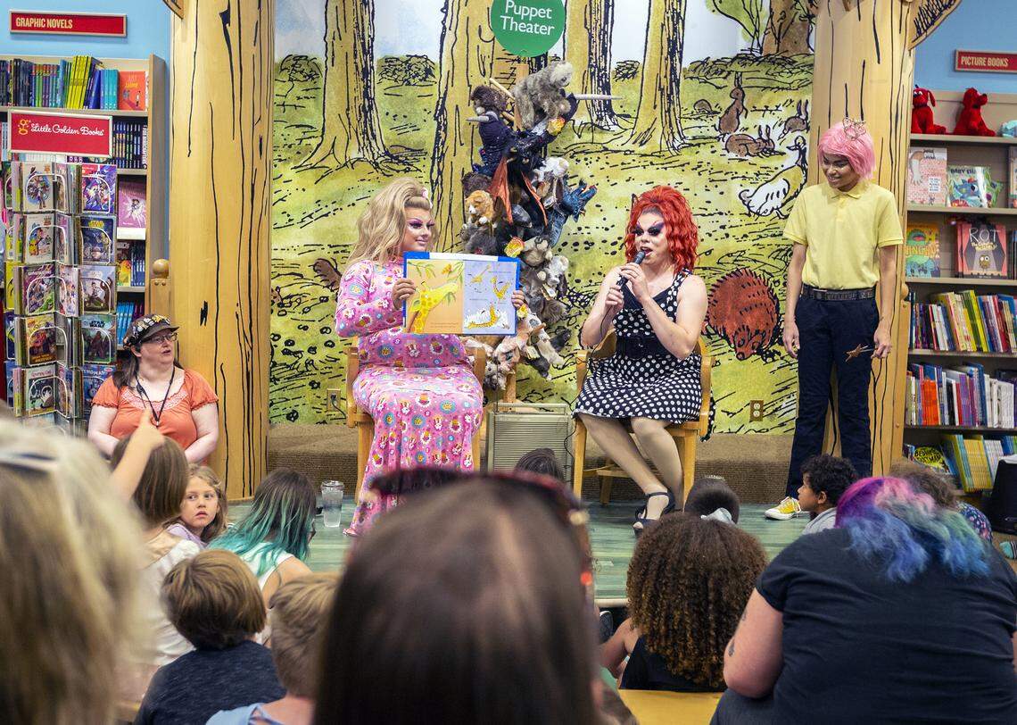 Hundreds of people arrived for Drag Queen Story Time with stories read by Sugar, left, and Tatiana Rexia at Barnes & Noble in Kennewick on Saturday.