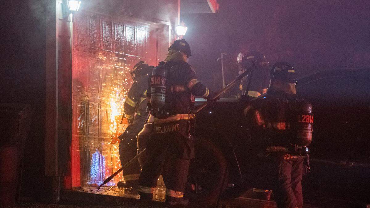 A family of five in Pasco was forced out of their home after a fire started in the garage of their Spieden Drive home. Firefighters cut through a garage door to get to the fire.