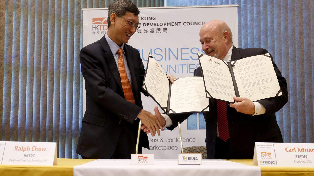 Carl Adrian, president and CEO of the Tri-City Development Council, right, is leaving after 16 years leading the region’s leading economic development agency.