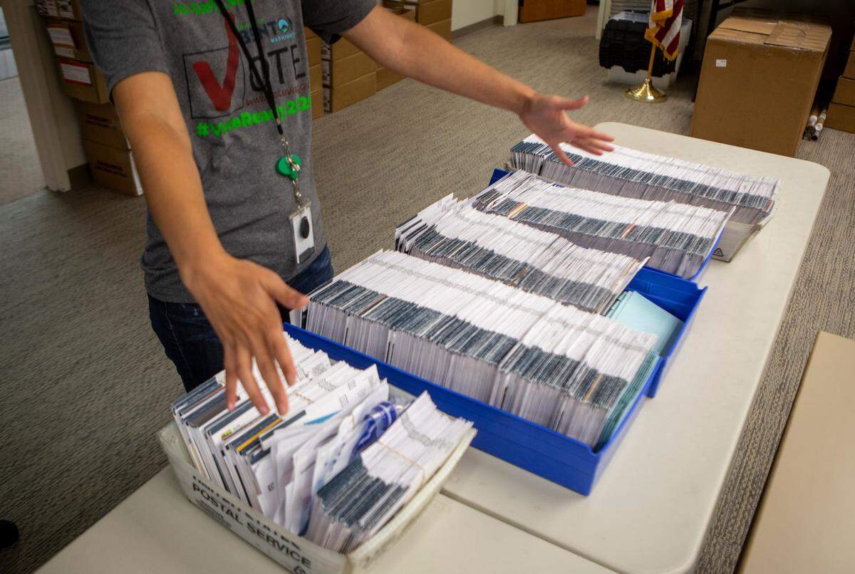 Amanda Hatfield, elections manager with the Benton County Auditor’s Office in Prosser, shows the local ballots that were not counted during the Aug. 4 primary election.