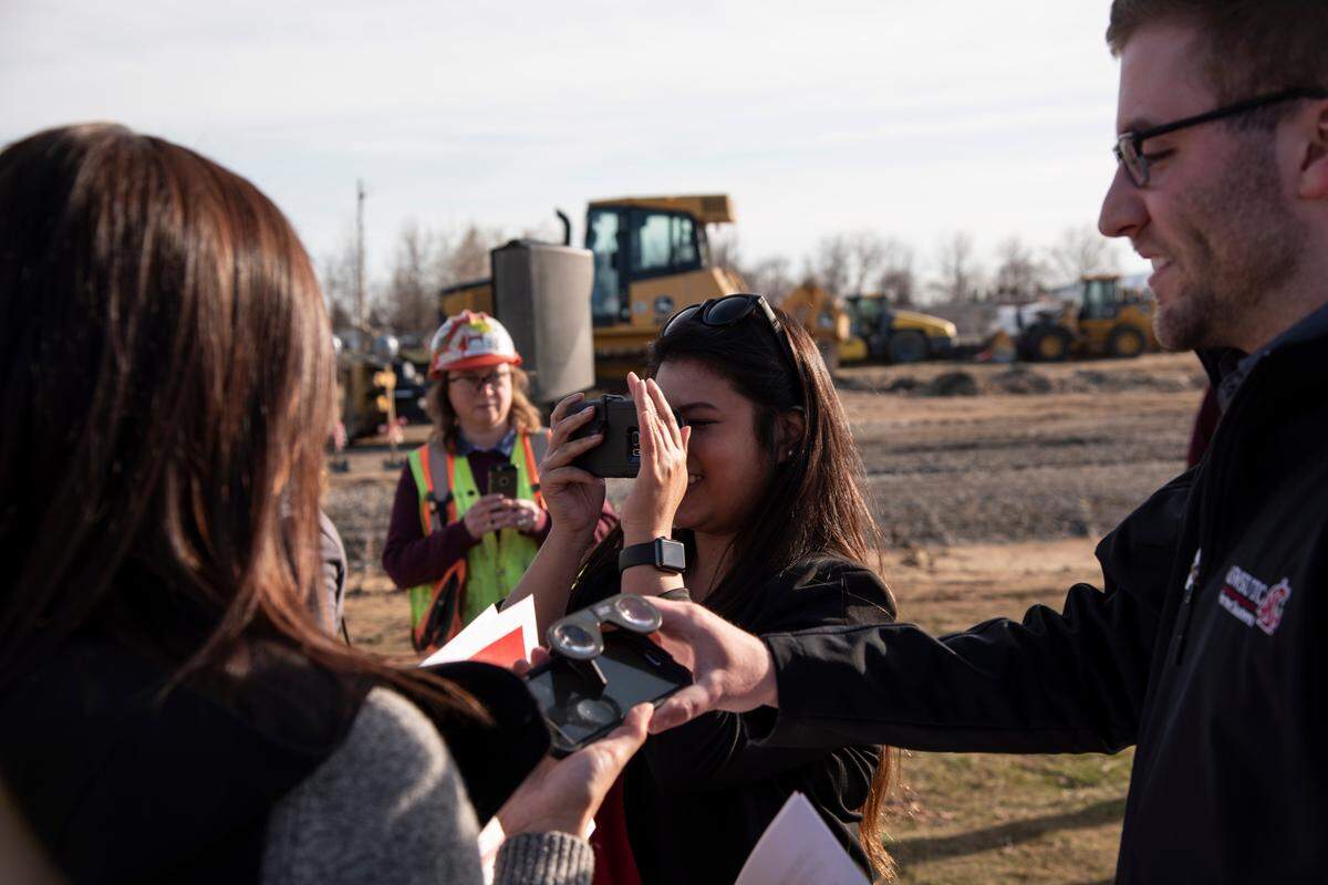 WSU student regent Johanna Pantig, 26, looks at a virtual reality animation for a new academic complex being built on the WSU Tri-Cities campus during the recent groundbreaking ceremony.