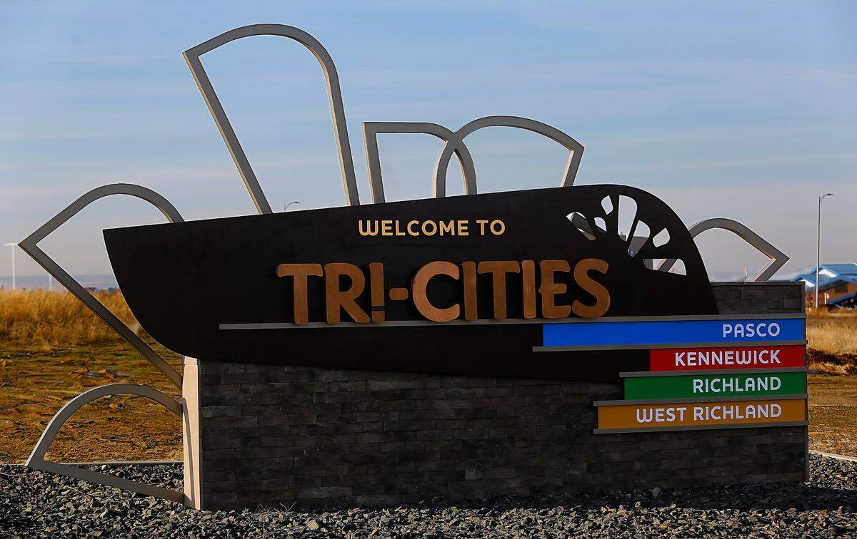 A Welcome to the Tri-Cities sign greets drivers on 20th Avenue near the Tri-Cities Airport in Pasco.
