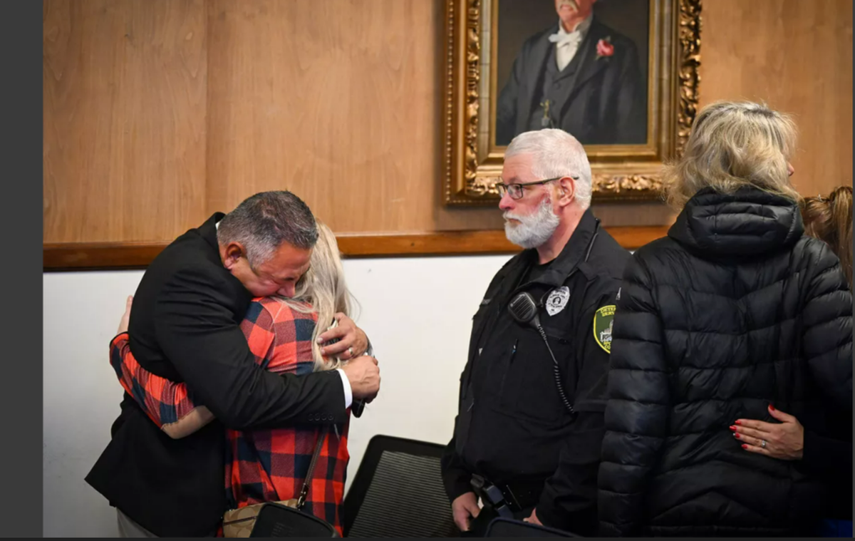 Richard Aguirre, 59, left, hugs his wife after being convicted, Tuesday, Dec. 26, 2023, for the 1986 killing of Ruby Doss, 27. Judge Jeremy Schmidt ruled Aguirre guilty of first-degree murder.