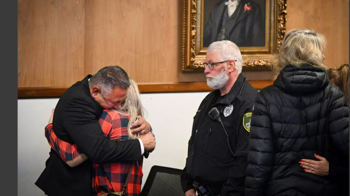 Richard Aguirre, 59, left, hugs his wife after being convicted in December 2023 in the 1986 killing of Ruby Doss, 27.